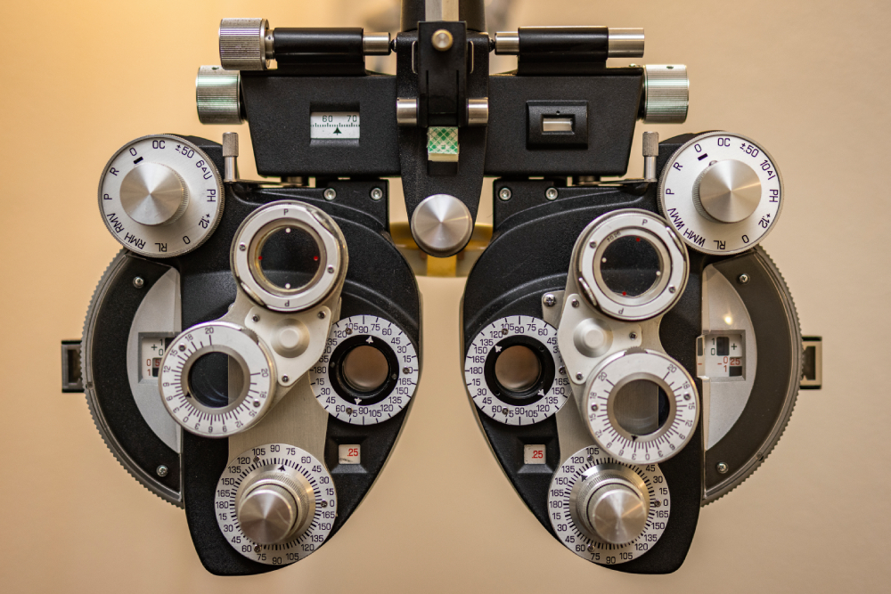 cta image Close-up view of an optometrist's phoropter, a device used for measuring refractive error and determining eyeglass prescriptions during an eye exam.