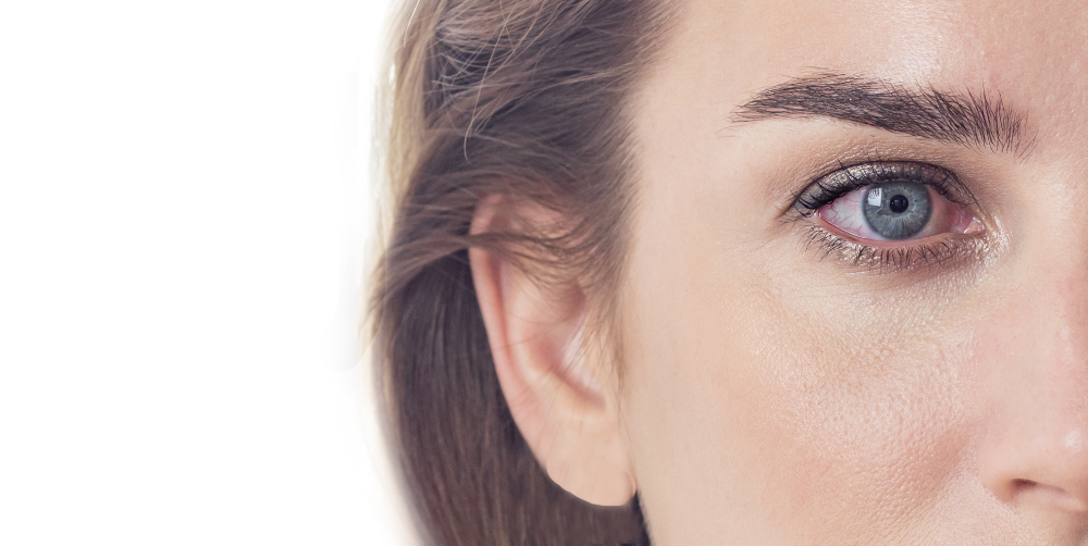 Close-up of the right side of a person’s face, showing blue eye, eyebrow, ear, and part of the cheek with clear skin—highlighting features often examined in cases of dry eye disease.